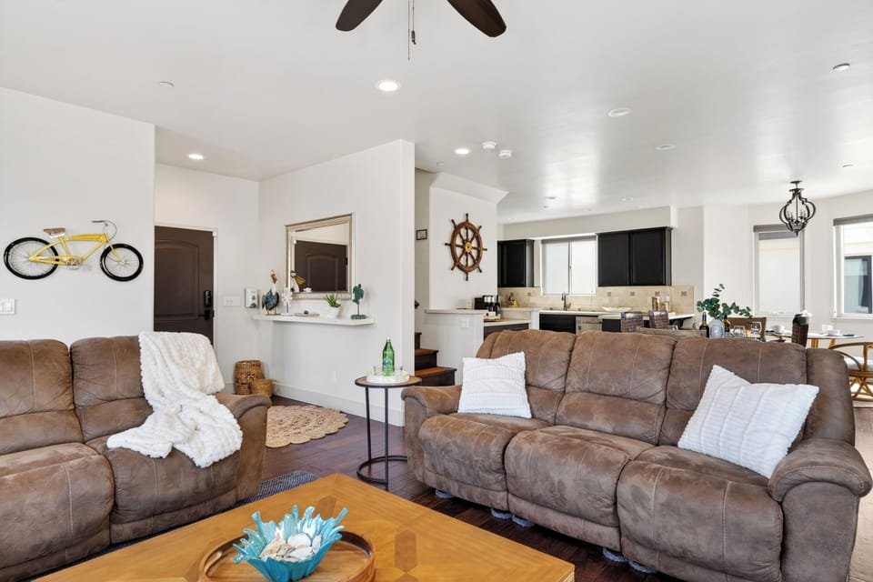 A seamless open-concept layout easily connects the living room, dining area, and kitchen for a spacious feel.