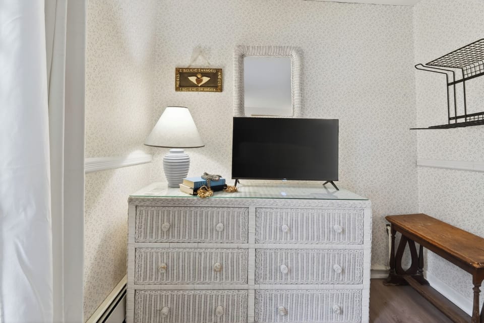 Bedroom 3 features a queen bed and a TV.