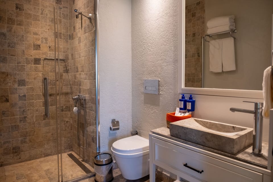 Luxury Suite, Garden View | Bathroom | Shower, designer toiletries, hair dryer, slippers