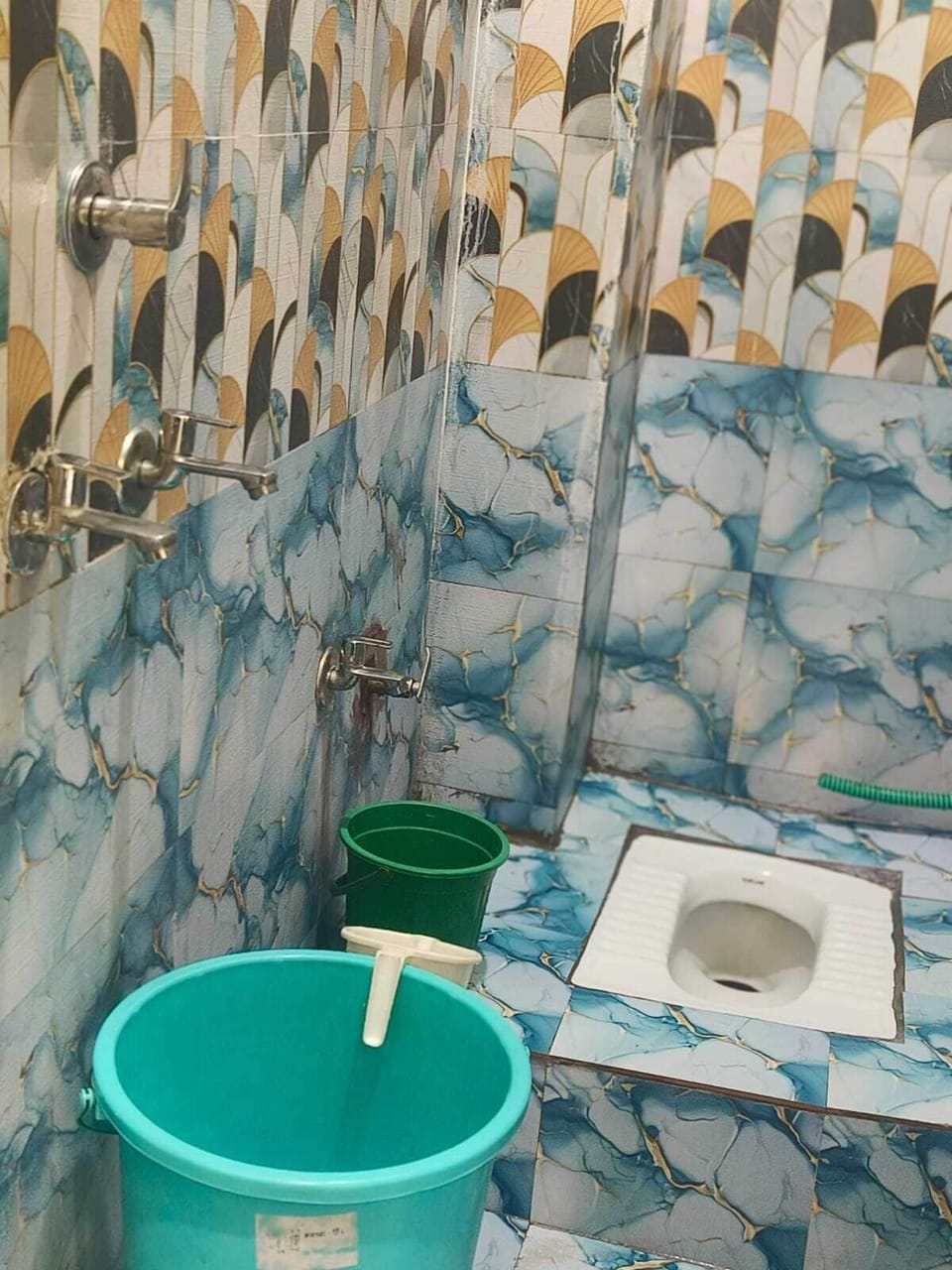 Comfort Quadruple Room, City View | Bathroom | Shower, free toiletries, slippers, towels