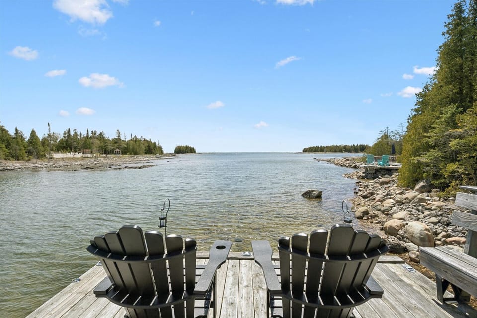 Relax by the water’s edge with stunning views of Bradley Harbour from the private dock seating area.