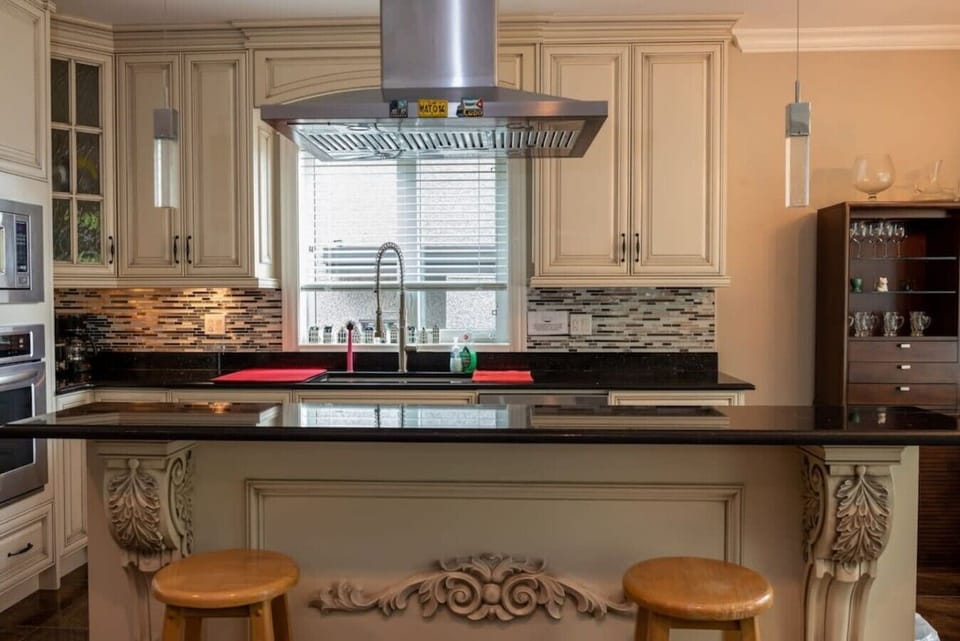 Stylish kitchen with oversized island and custom detailing