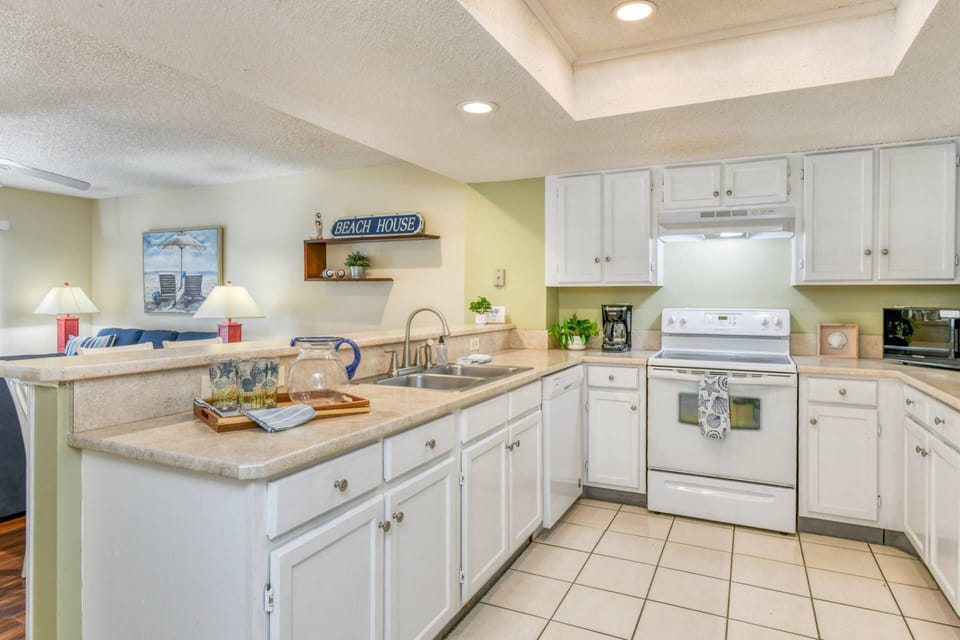 The fully stocked kitchen has everything you need to prepare your favorite foods and drinks.