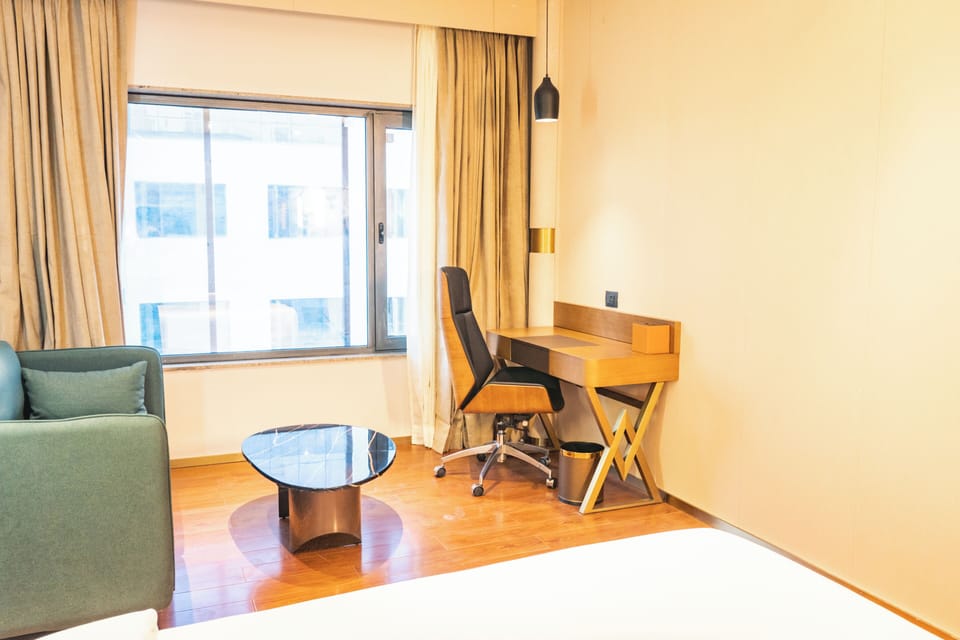 Minibar, desk, blackout drapes, iron/ironing board