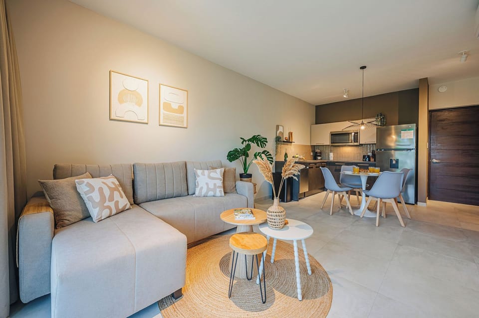 Neutral tones and modern furnishings create a calm open concept space perfect for unwinding indoors.