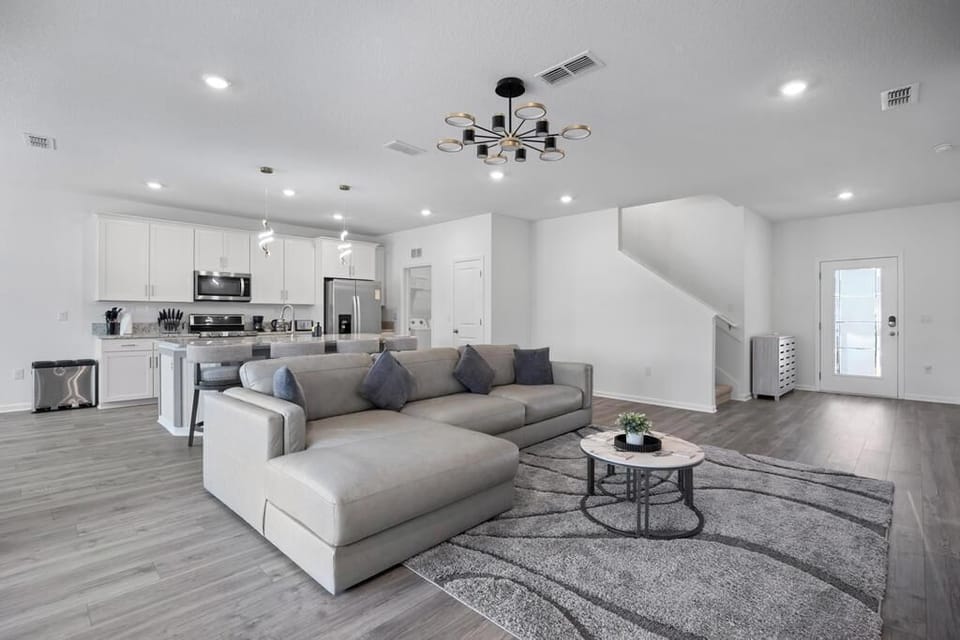 Bright open-plan kitchen & living area w/ an island & room for the whole group.