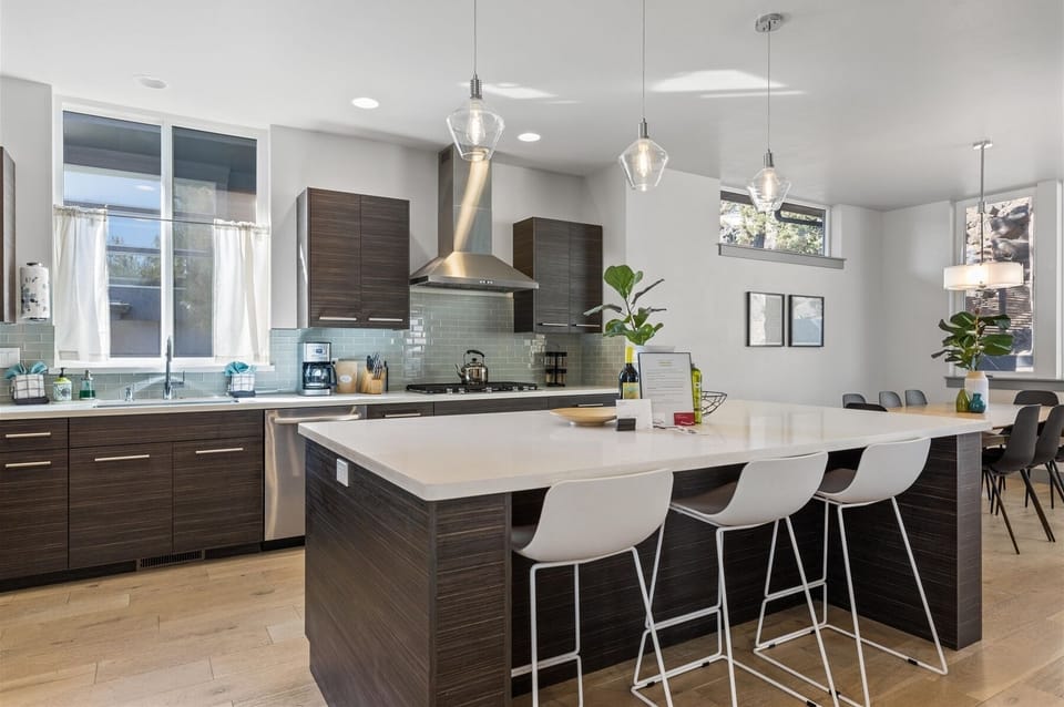 Breakfast bar seating for three in the kitchen area.