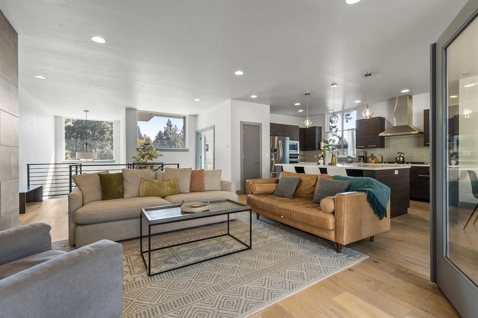 Living room with smart TV and gas fireplace - Cozy up in style! This living room is perfect for relaxation and gathering, with direct views of the backyard.