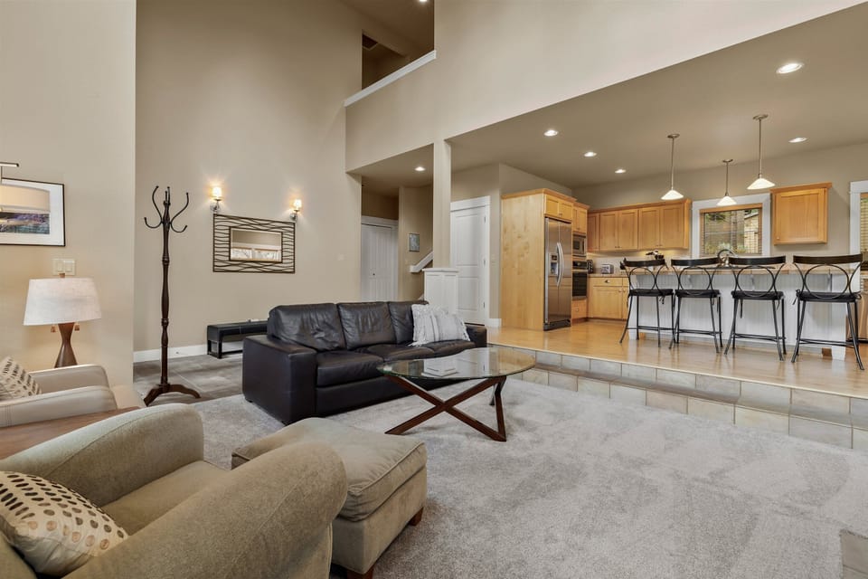 Spacious open-concept living and kitchen area with natural light.