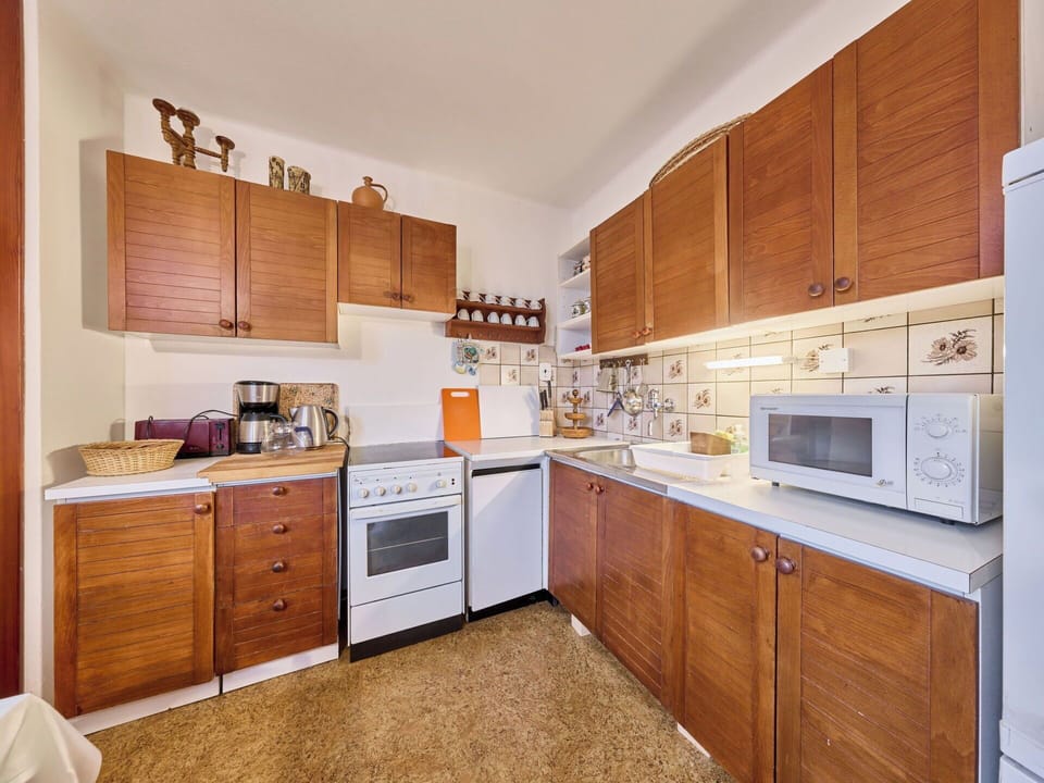 Kitchen, Cabinetry, Kitchen Appliance, Major Appliance, Countertop, Wood, Flooring, Interior Design, Furniture, Cupboard