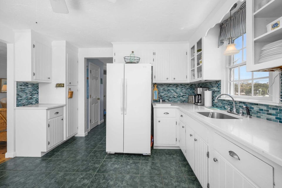 Kitchen leading to bathroom