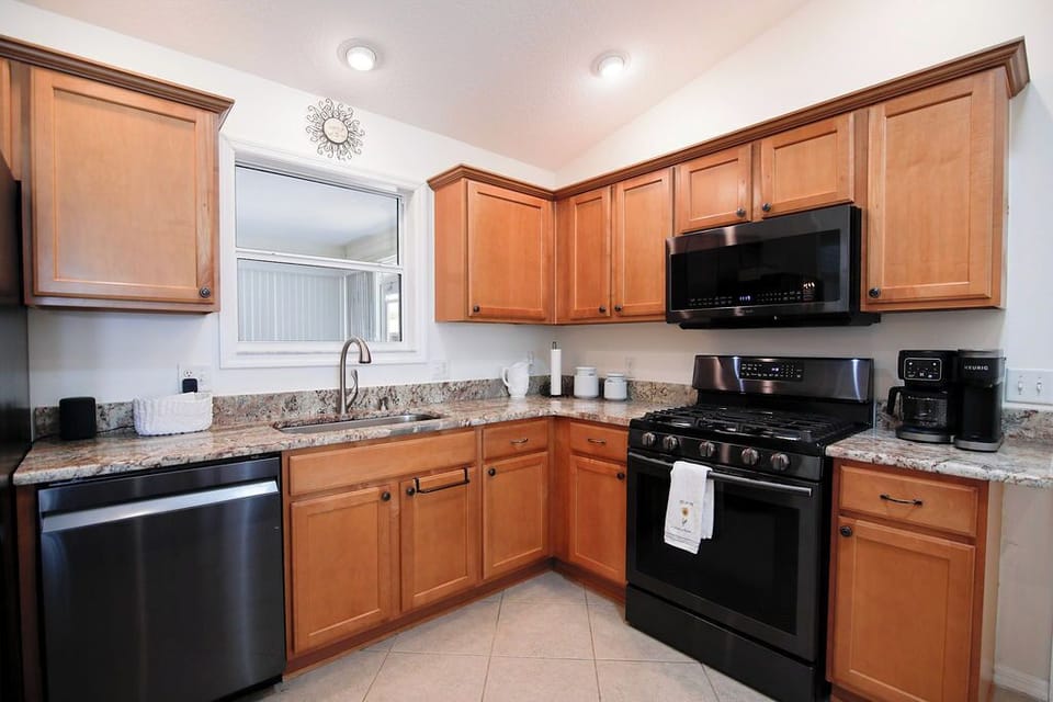 Your fully equipped kitchen has everything you need to whip up a quick breakfast or cozy dinner, with modern appliances, granite counters, and plenty of space to gather around.
