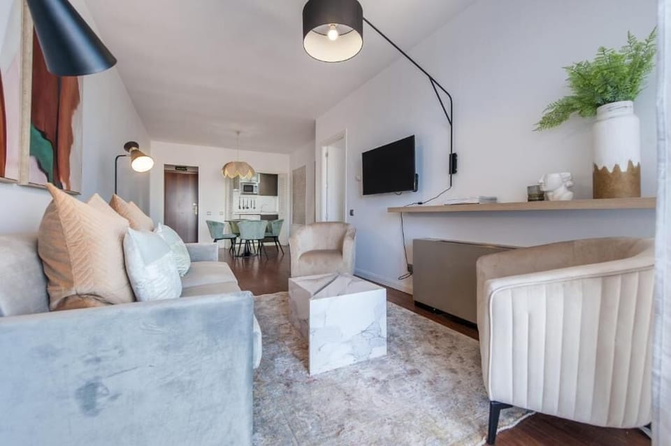 Apartment, Balcony, City View | Living area | 32-inch flat-screen TV with cable channels