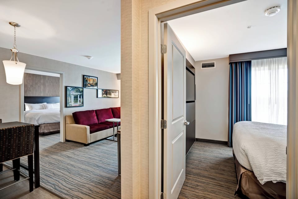 Suite, 2 Bedrooms | Premium bedding, desk, iron/ironing board, free cribs/infant beds