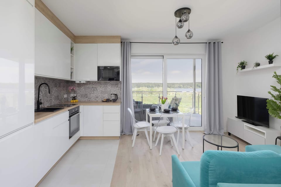 Bright open-plan studio with dining area and contemporary furnishings