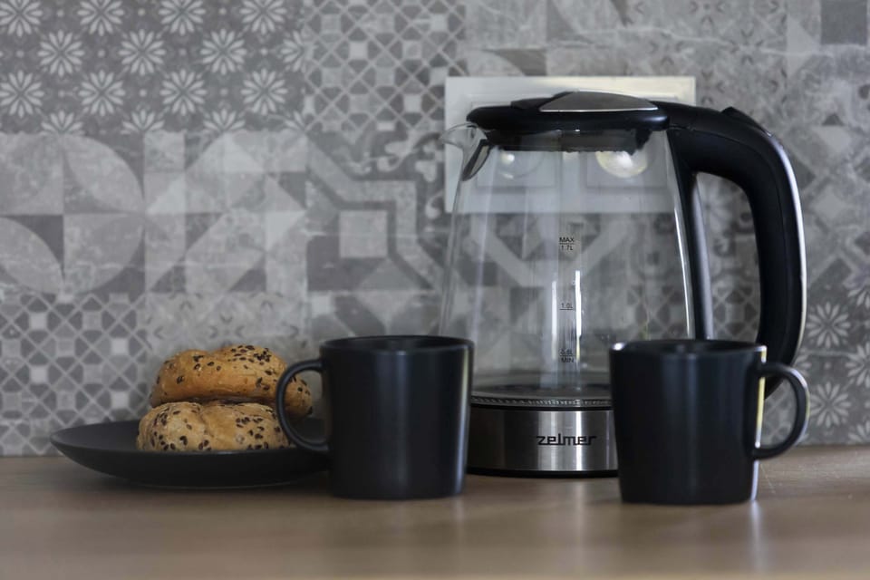 Stylish kitchen detail with electric kettle and modern decor accents