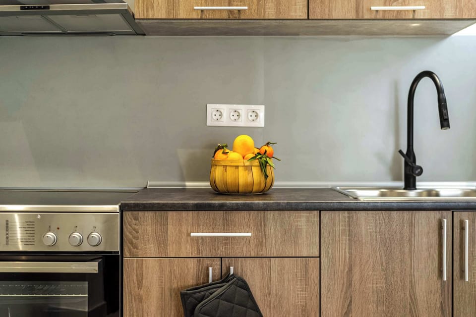 Modern kitchen counter with fresh fruit and all the essentials for everyday cooking