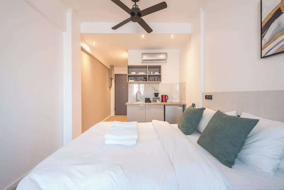 Interior view toward kitchenette emphasizes open-plan flow and practical use of available space.