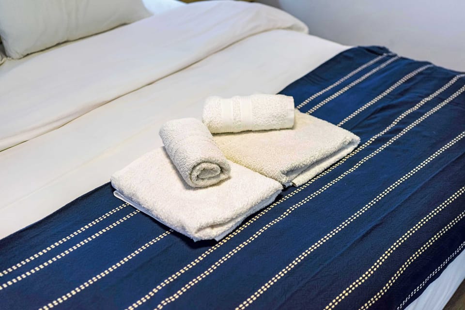 Soft linens, thoughtful arrangement, and tranquil tones invite rest, renewal, and a sense of hospitality