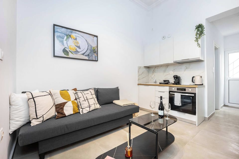 Compact sofa styled for relaxed evenings after exploring the city.