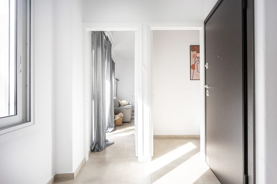 Natural light, airy layout, and subtle decor combine to create a welcoming, modern sense of arrival.