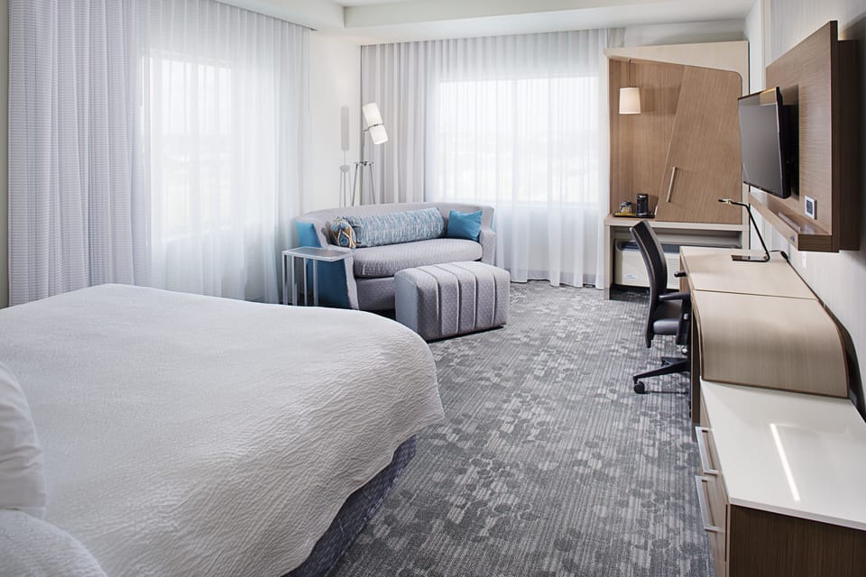 Premium bedding, down comforters, desk, laptop workspace