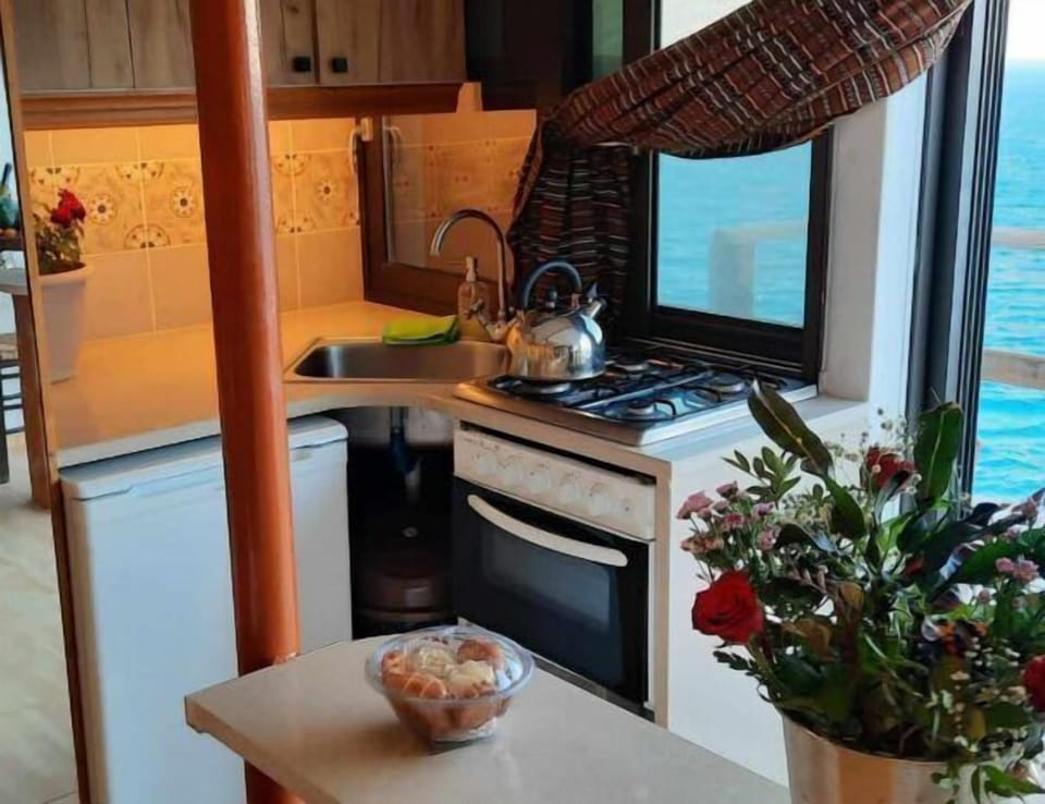 The kitchen with sea light beyond