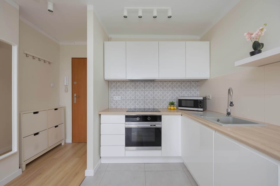 Well-equipped kitchenette with essential appliances, practical storage space and everything needed for preparing everyday meals during your stay.