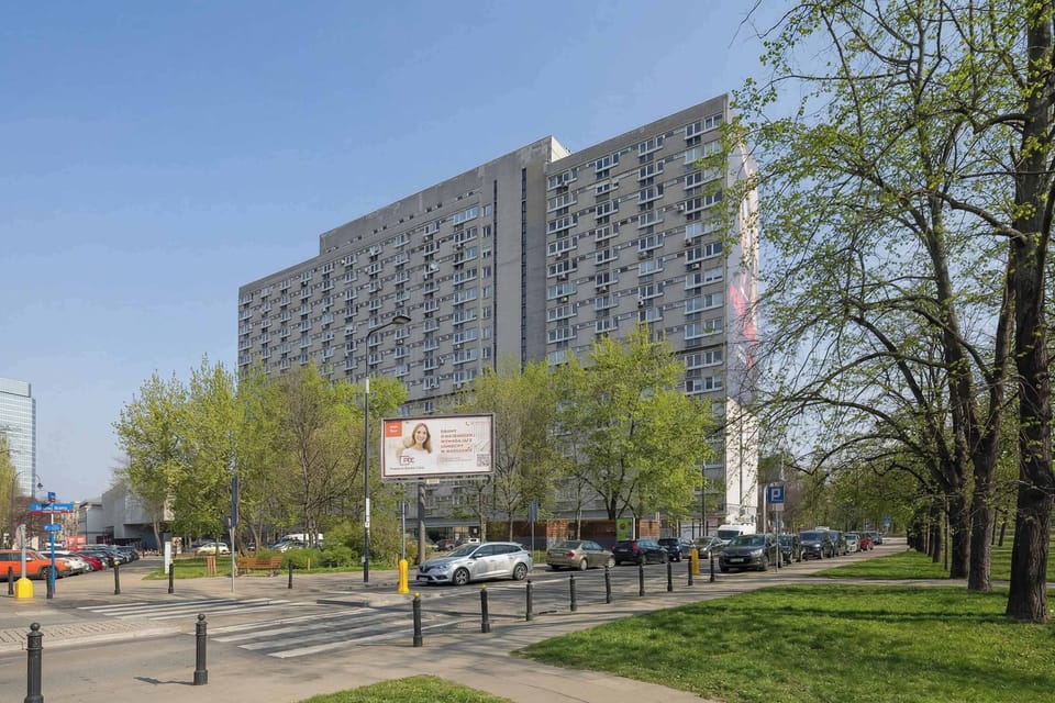 Exterior view of the residential building surrounded by greenery, showing the property's setting within the neighbourhood.