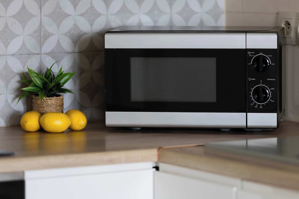 Kitchenette detail featuring a microwave, worktop space and useful kitchen amenities for preparing meals and snacks.