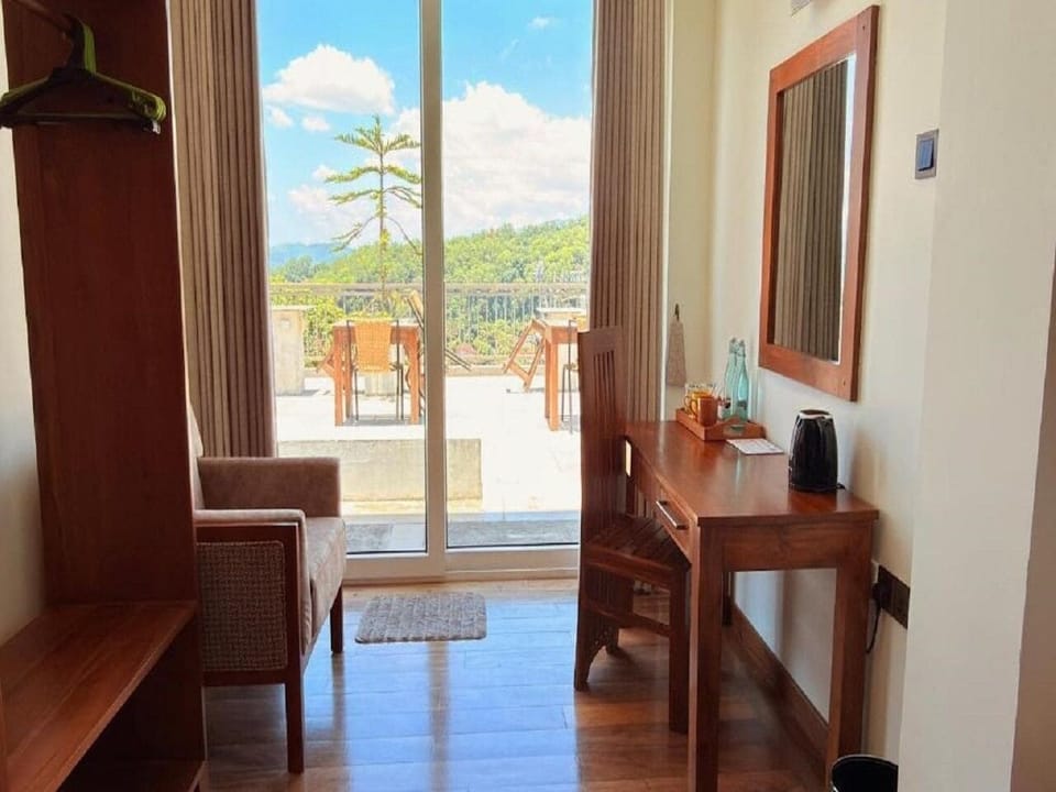 Deluxe Double Room, Balcony, Garden View | Living area | TV