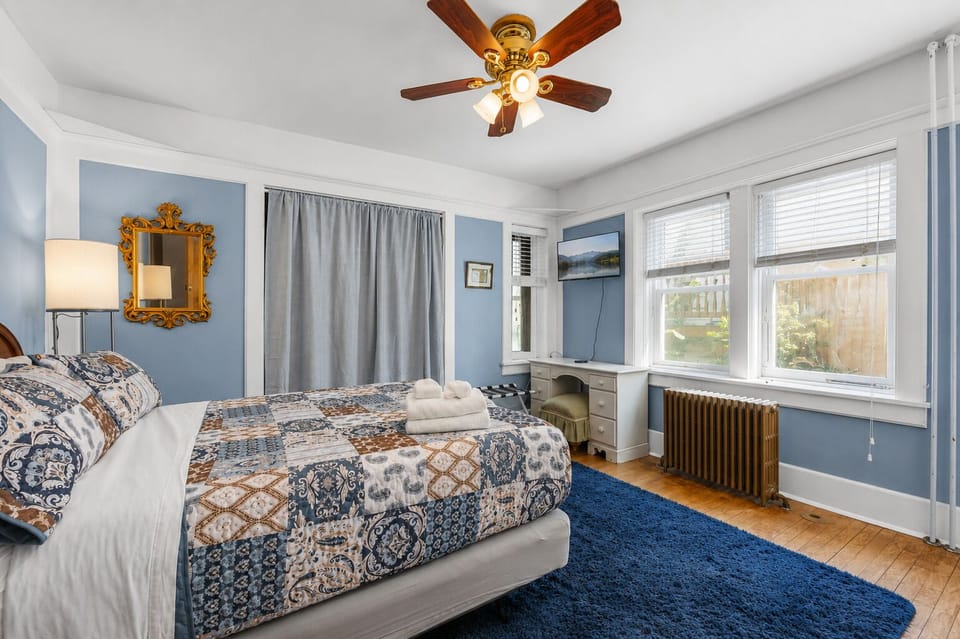 Sherman Suite Queen Bedroom: Large windows and a charming desk nook