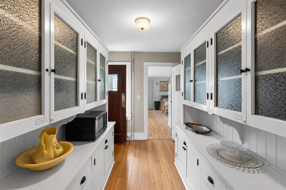 Bright hallway with stylish built-ins and abundant storage space