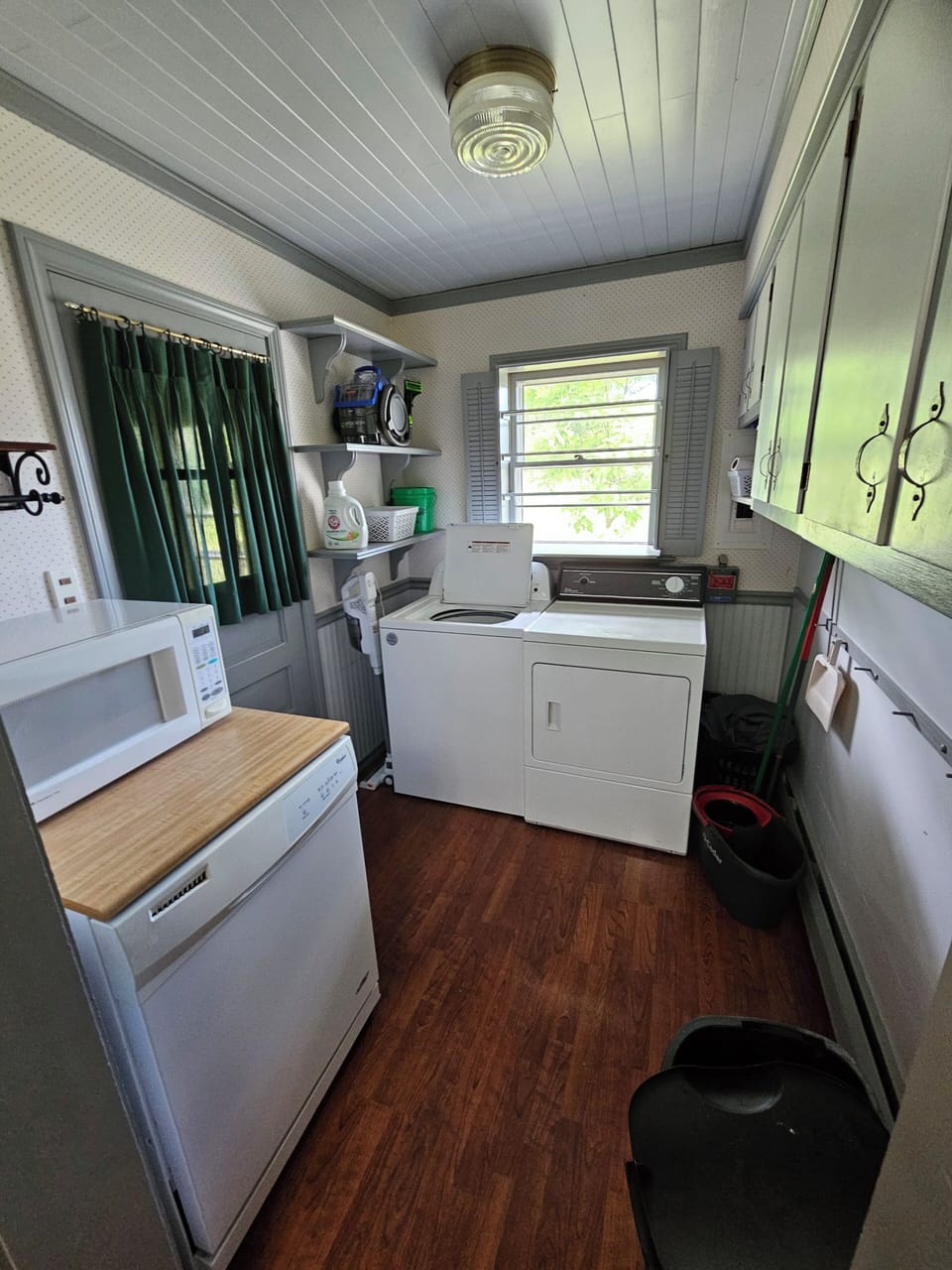 laundry room off the kitchen with dishwasher, microwave, washer & dryer