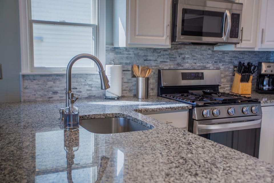 Stainless steel deep sink. Touchless facuet. State of the art flame stove. Knife