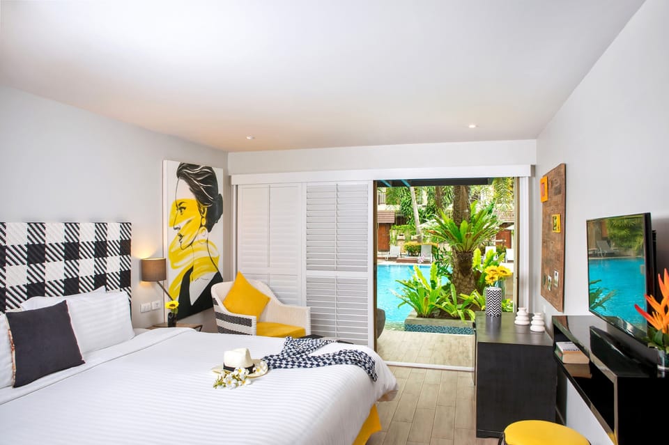 Premier Room, Pool Access | Minibar, in-room safe, desk, blackout drapes