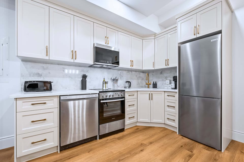 Kitchen with essential amenities and cabinets designed for easy everyday meal preparation