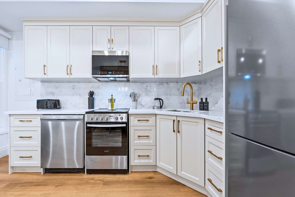 Kitchen with storage cabinets and essentials for easy meal preparation