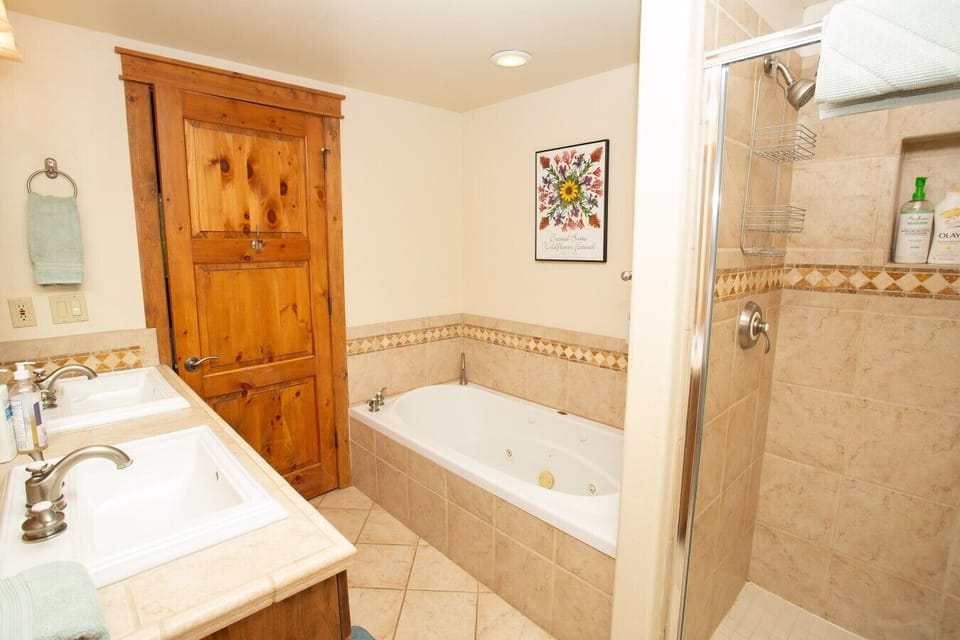 Ensuite master bathroom with jetted tub, shower and double sinks.