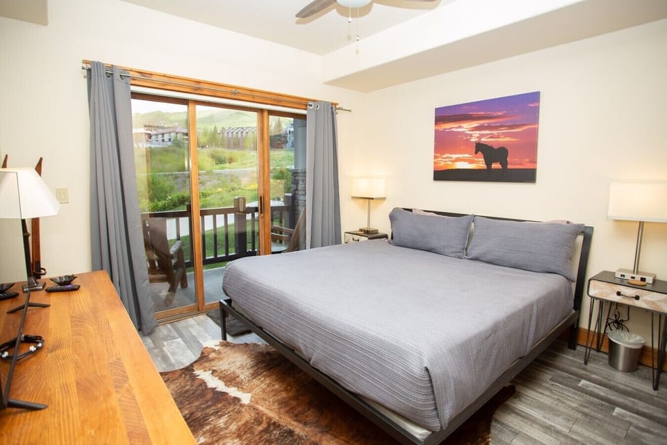 Master bedroom with king bed, patio access, and ensuite bathroom.