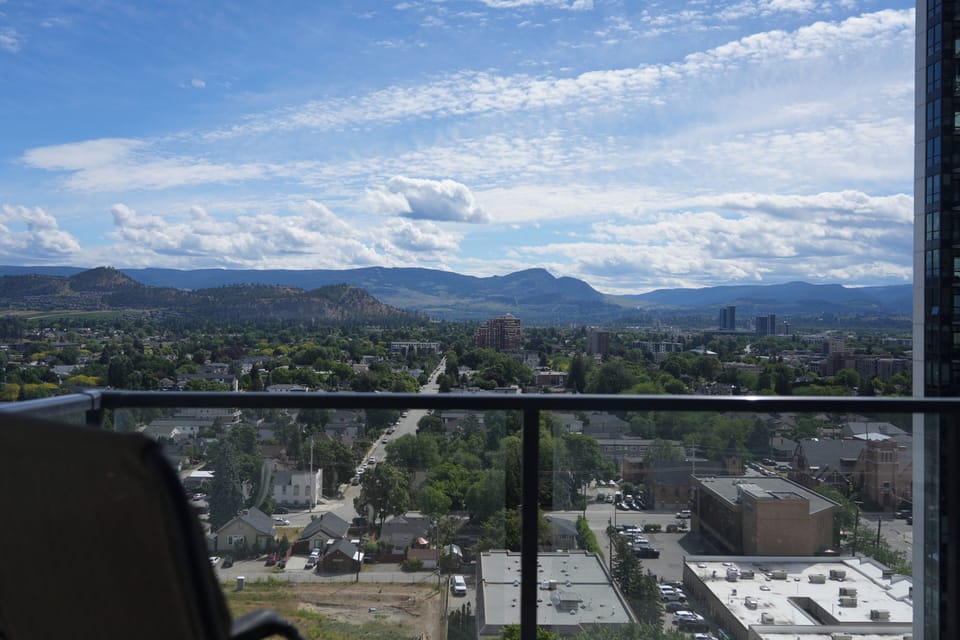 city and mountain view from the property balcony