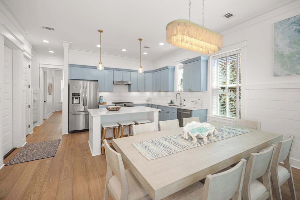 Dining area: Main floor, table seating for 8, 3 barstools at island