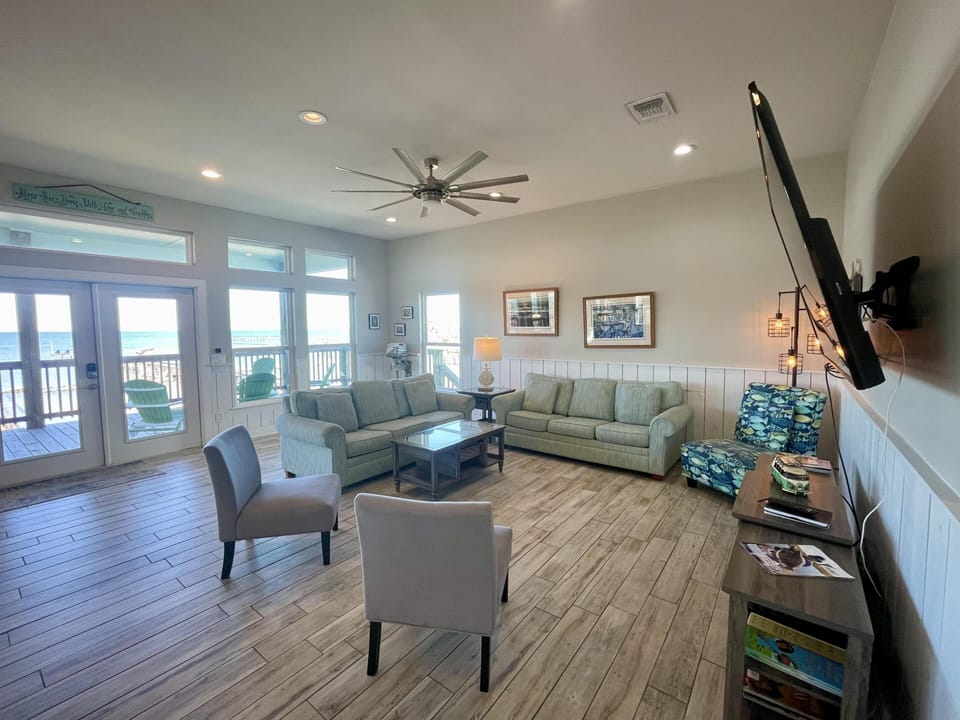 Spacious coastal living room with bay views.