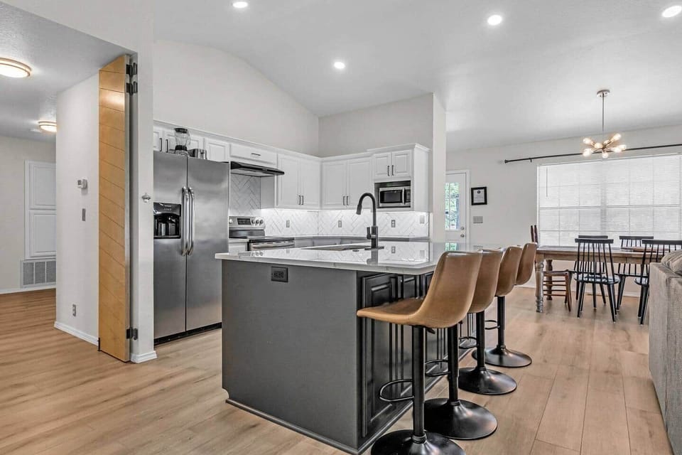 Remodeled kitchen with over sized island with seating