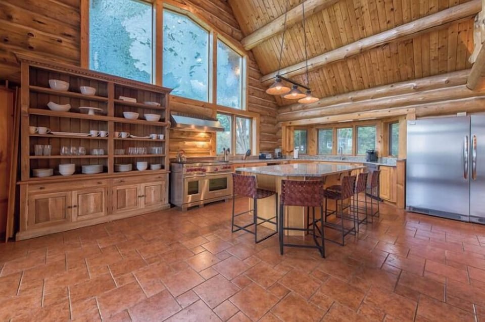 Newly renovated kitchen complete with a custom glass window, new granite, new appliances.