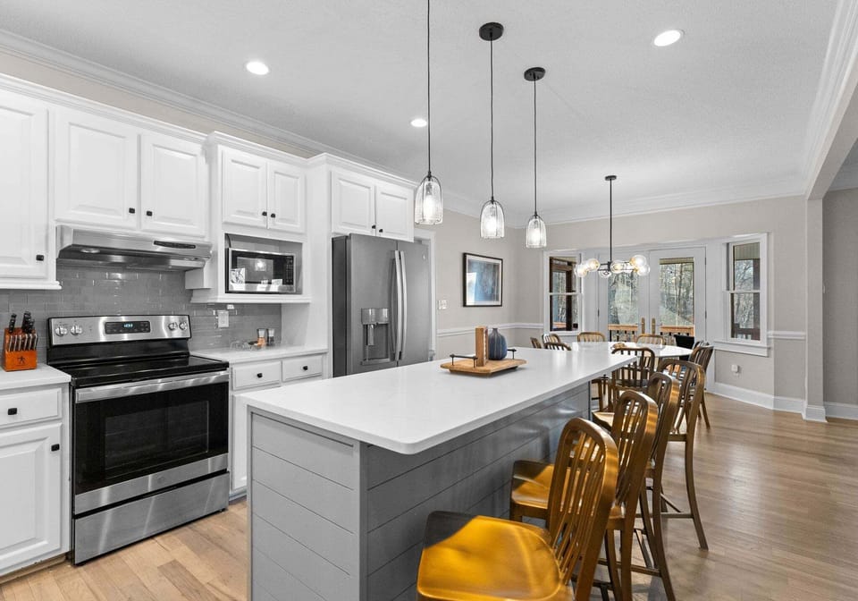 Main Level Kitchen with island seating and table seating 6.