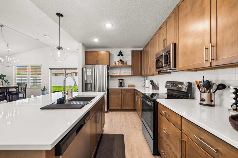 Spacious modern kitchen with island, stainless steel appliances