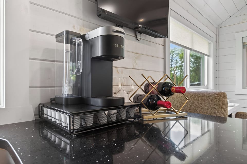 Stylish coffee and wine station with modern finishes and cozy cabin charm