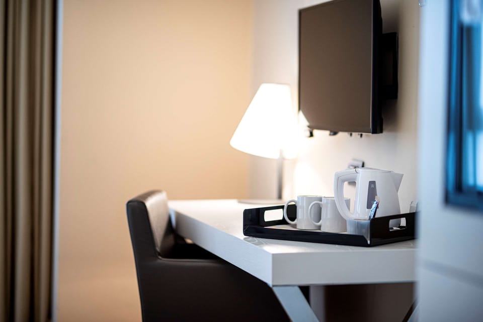 Comfort Twin Room | Down comforters, minibar, in-room safe, desk