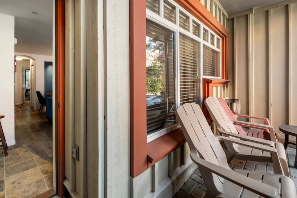 Front patio off foyer with 3 chairs and BBQ grill